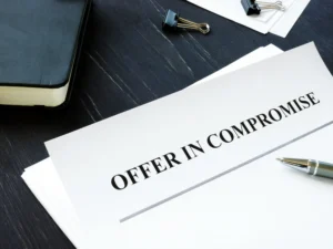 What is An Offer In Compromise? - Paper that says "Offer in Compromise"