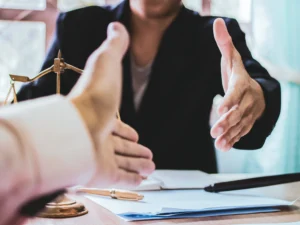 shaking hands with a law attorney - after answering IRS tax questions