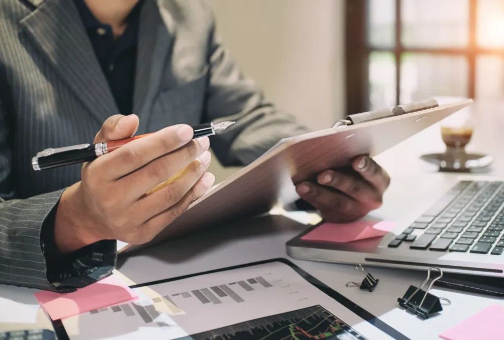 Person in business suit doing paperwork