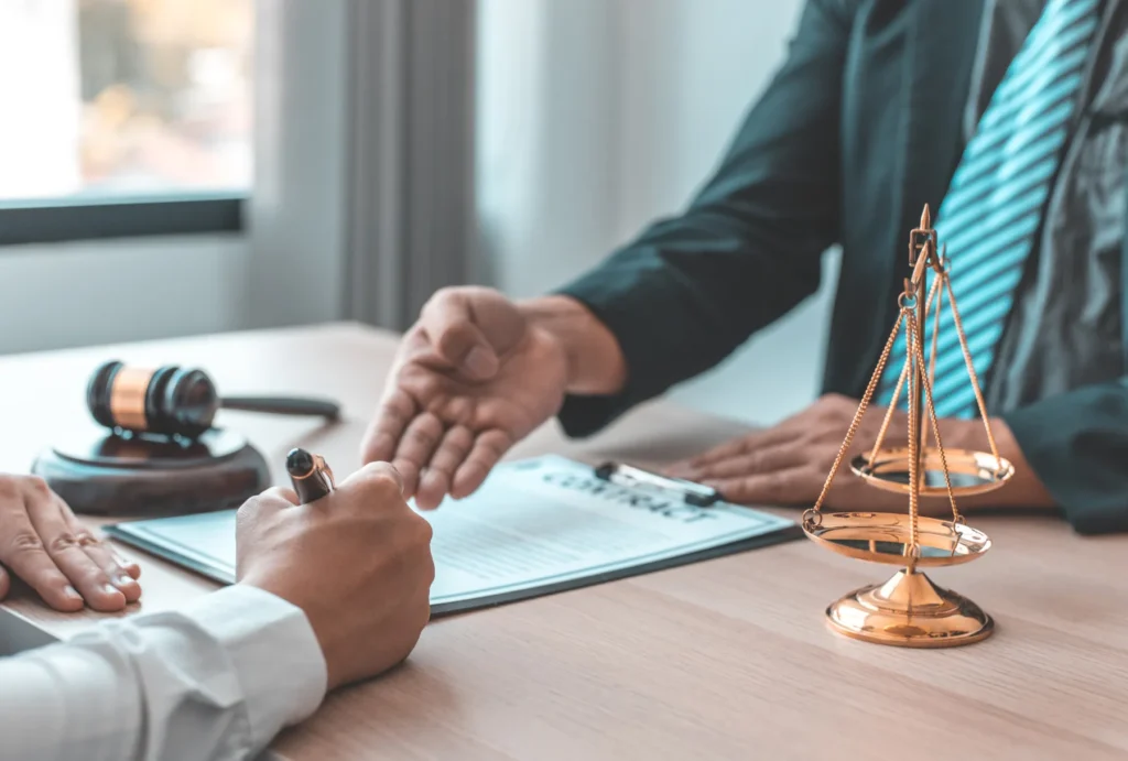attorney having a client sign a document