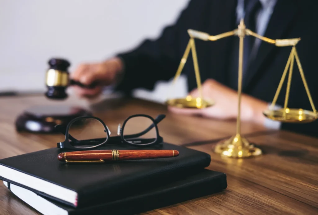 attorney's desk: notebooks, glasses, etc