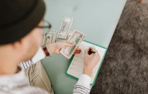 Woman sorting through bills and filling out document to apply for IRS payment plans